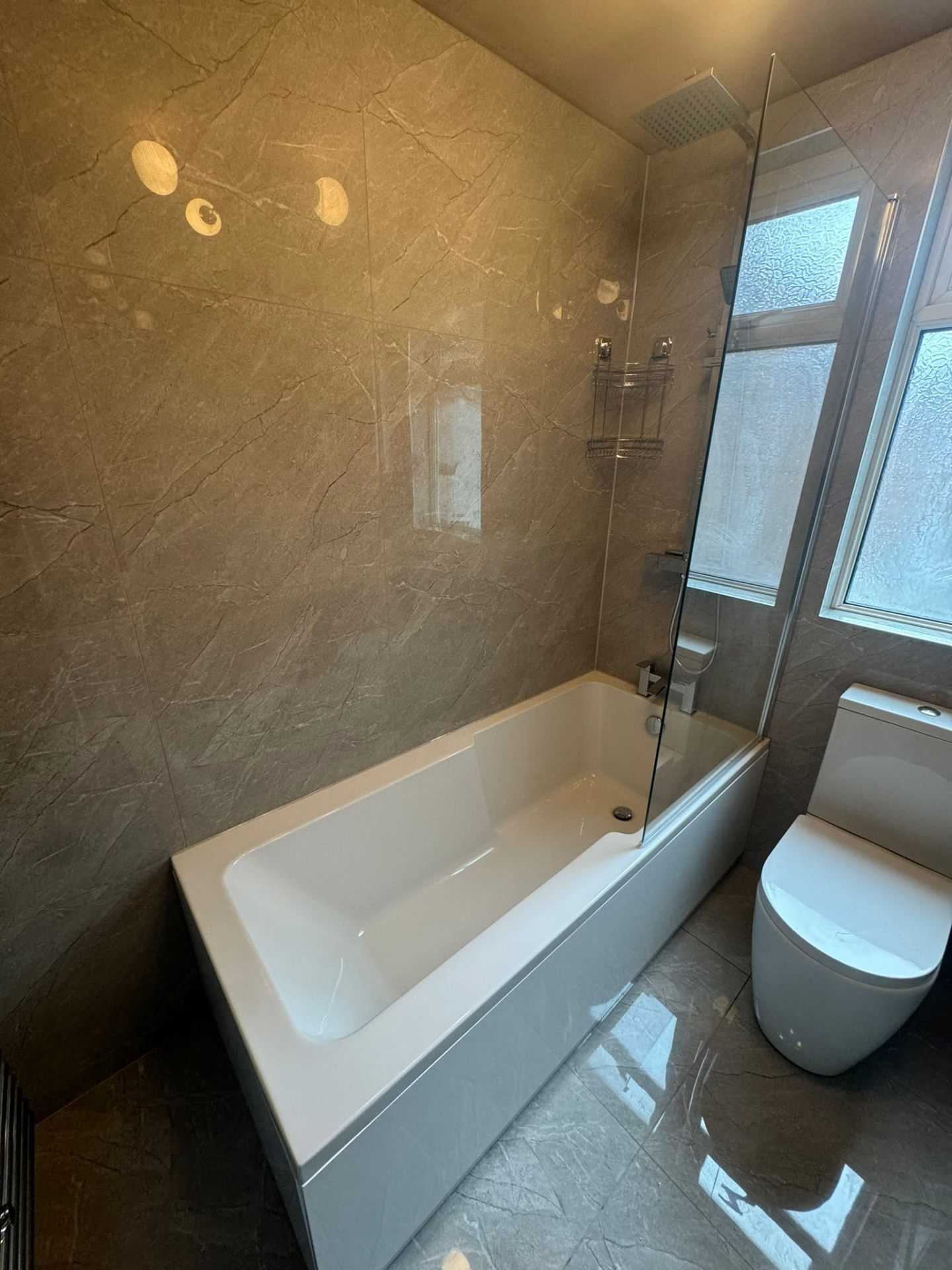 Frozen and burst pipe with ice formation in a Greater Manchester loft space during winter